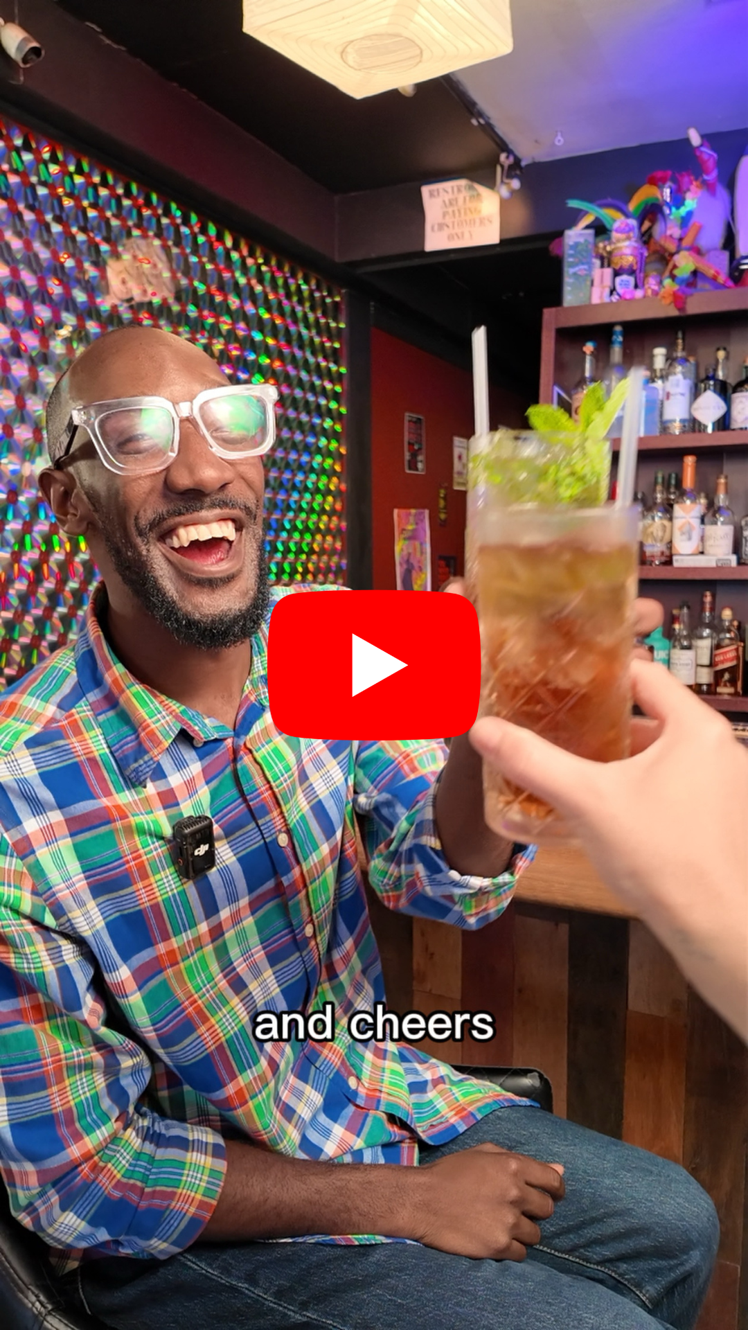 YouTube clip showing Will Johnson holding a mocktail in cheer.