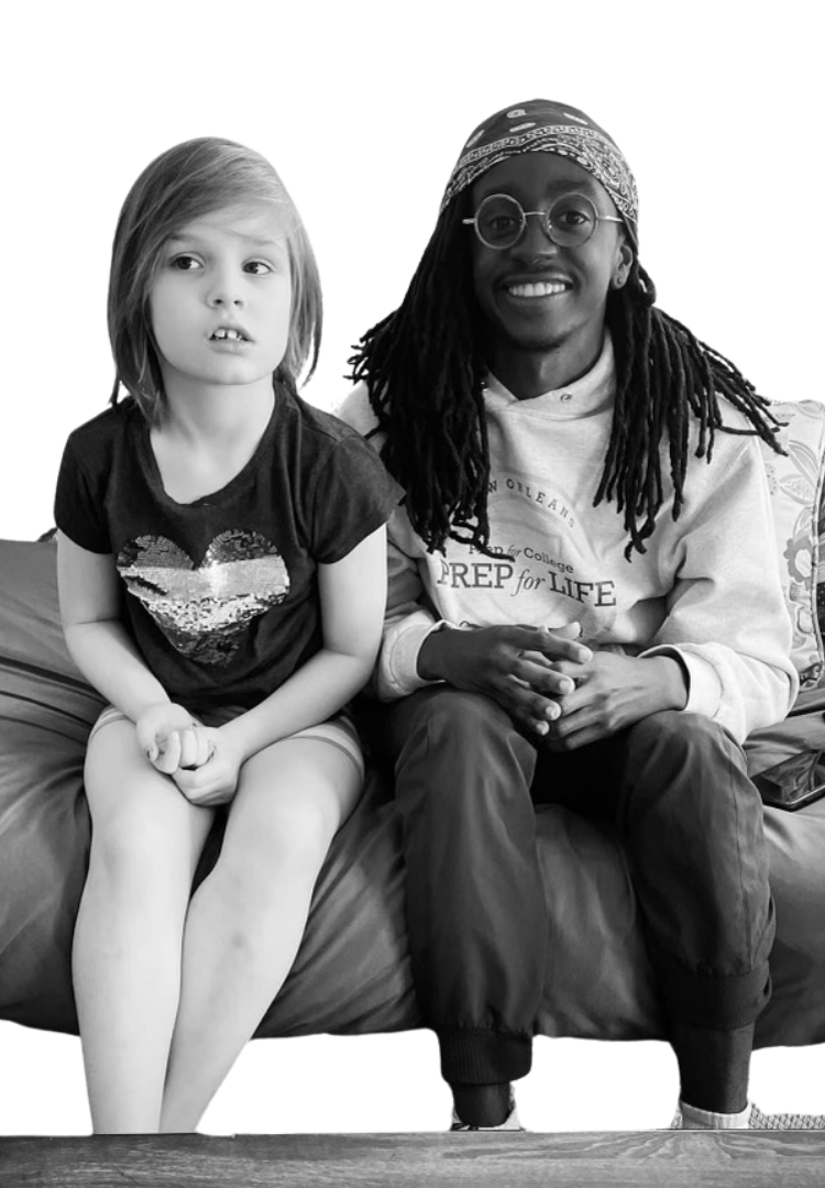 Scholar smiling with child huring home visit.